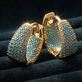 Elegantes aros de oro con perlas turquesas